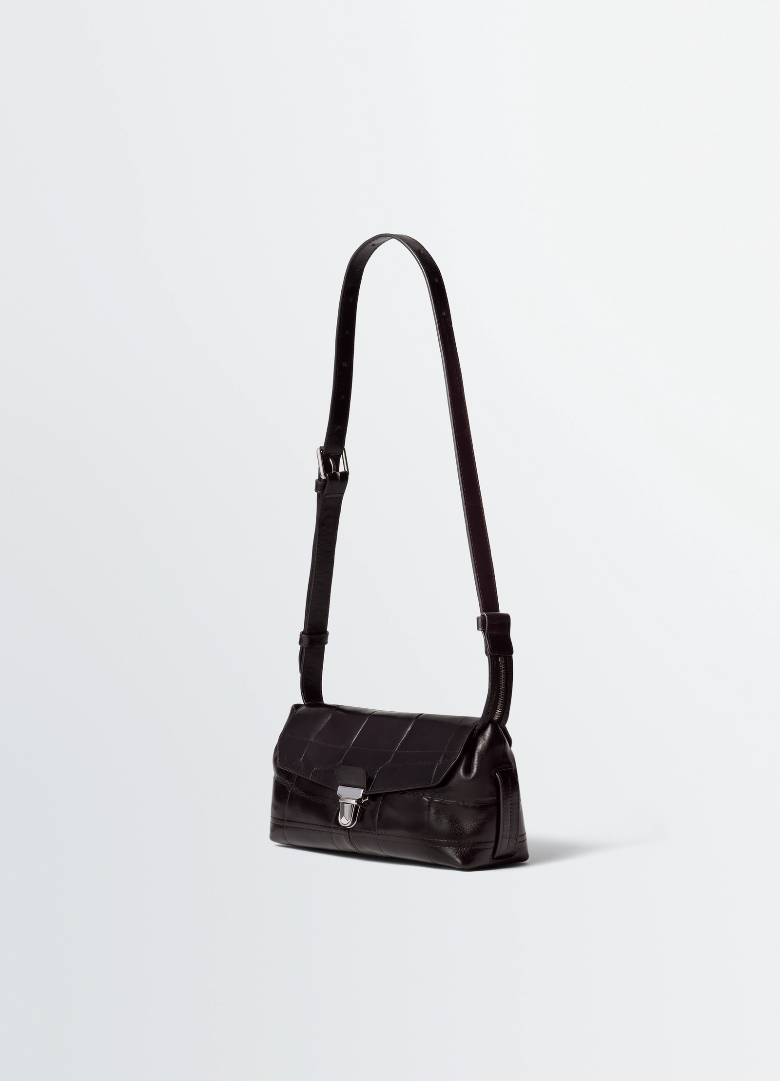 Small soft gear bag in black croco-embossed leather, product shot, three-quarter view adjustable shoulder strap
