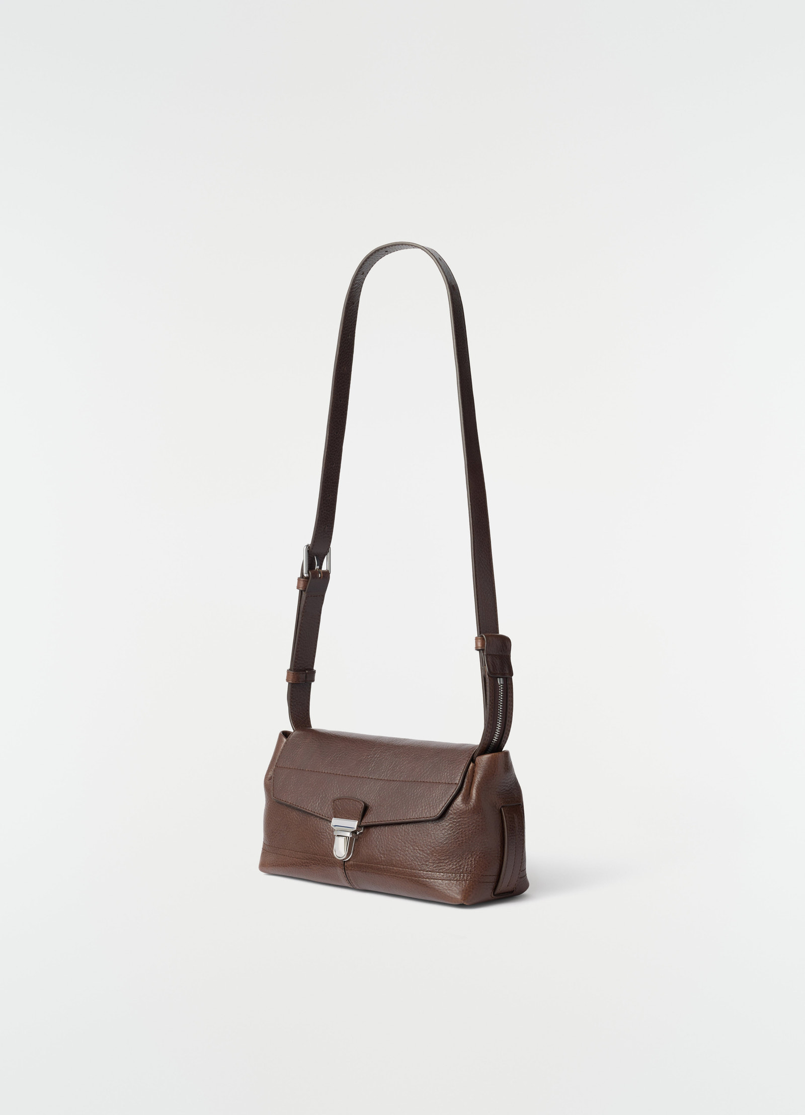 Small brown leather gear bag with silver clasp and adjustable strap lemaire side view on white background