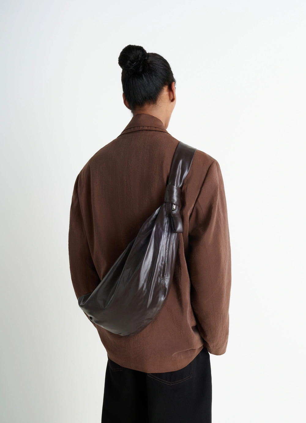 Lemaire Medium Soft Croissant in Paper-effect leather, model shot, back view draped on shoulder