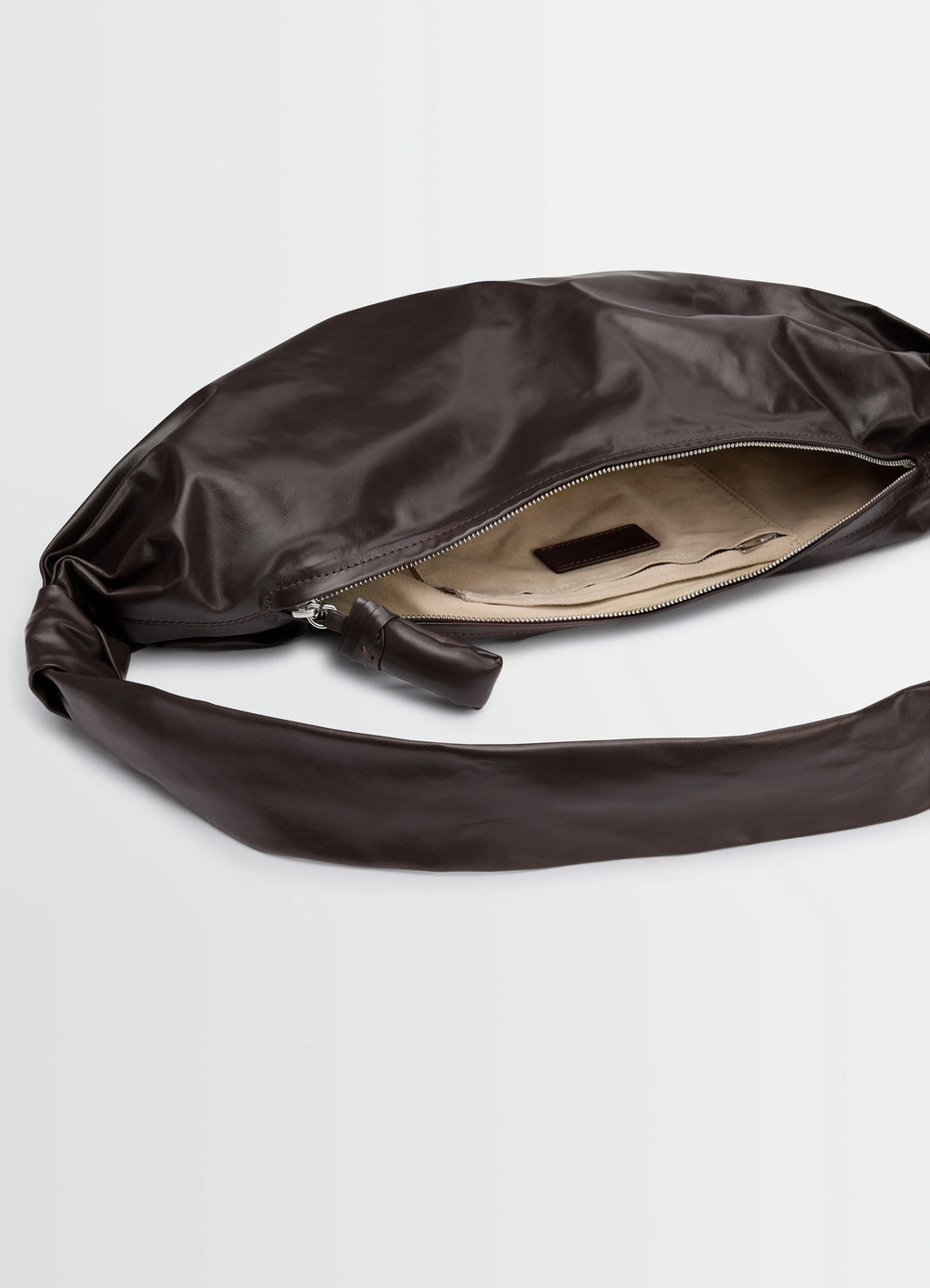 Lemaire Medium Soft Croissant in Paper-effect leather, product shot, top zipper detail exposed interior lining