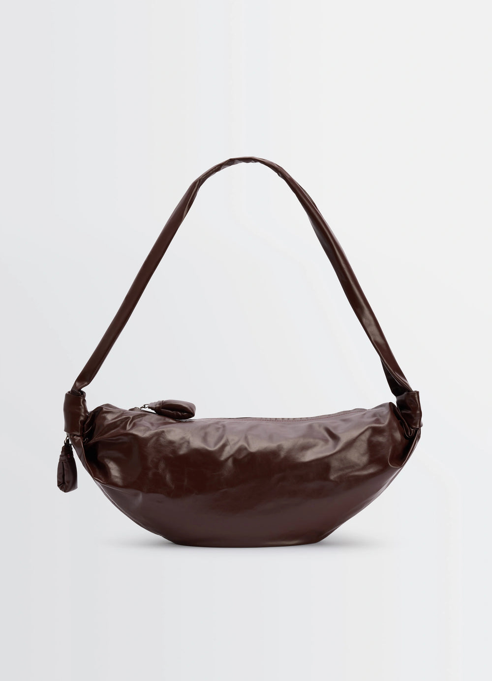 Lemaire Medium Soft Croissant in paper-effect leather, product shot, side view smooth texture, draped strap