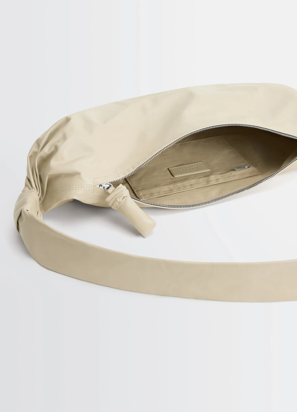 Lemaire Medium Soft Croissant in Paper-effect leather, product shot, top interior view knotted strap detail