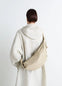 Lemaire Medium Soft Croissant in Paper-effect leather, model shot, Back view Knotted elements visible