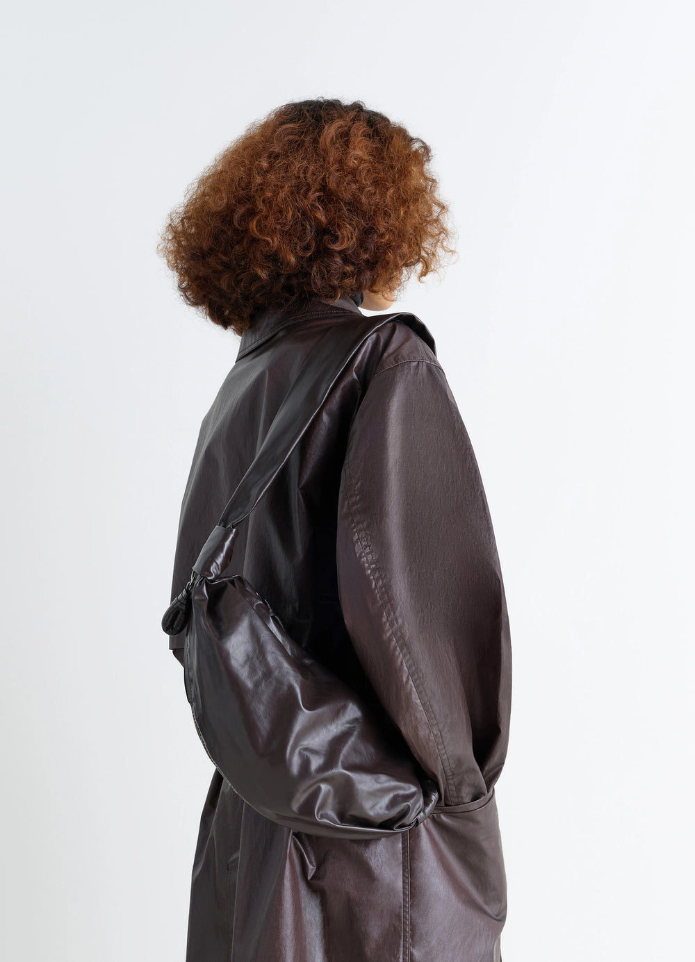 Small Soft Croissant Bag in Paper-effect Leather, model shot, Back view Knotted elements