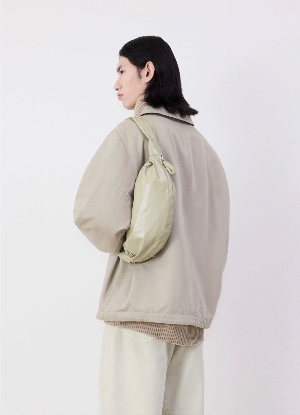 Small Soft Croissant in Lightweight Shiny Leather, model shot, over the shoulder shoulder bag styling