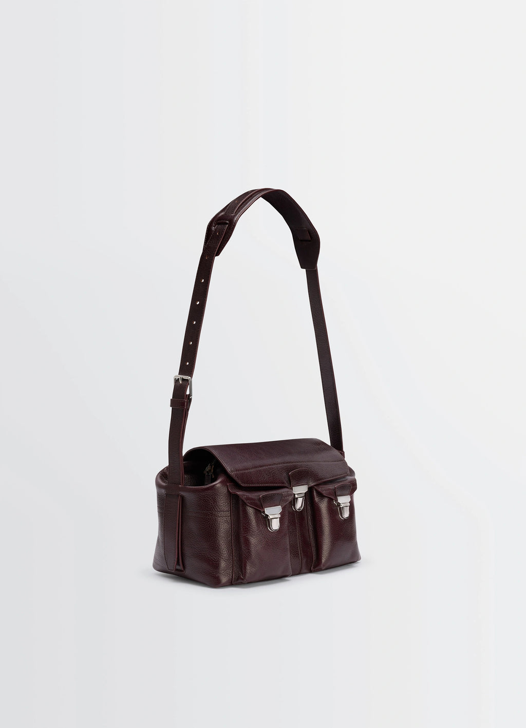 Lemaire Medium Gear Bag in Glossy Vegetable-Tanned Leather, product shot, angled top-front view adjustable leather strap