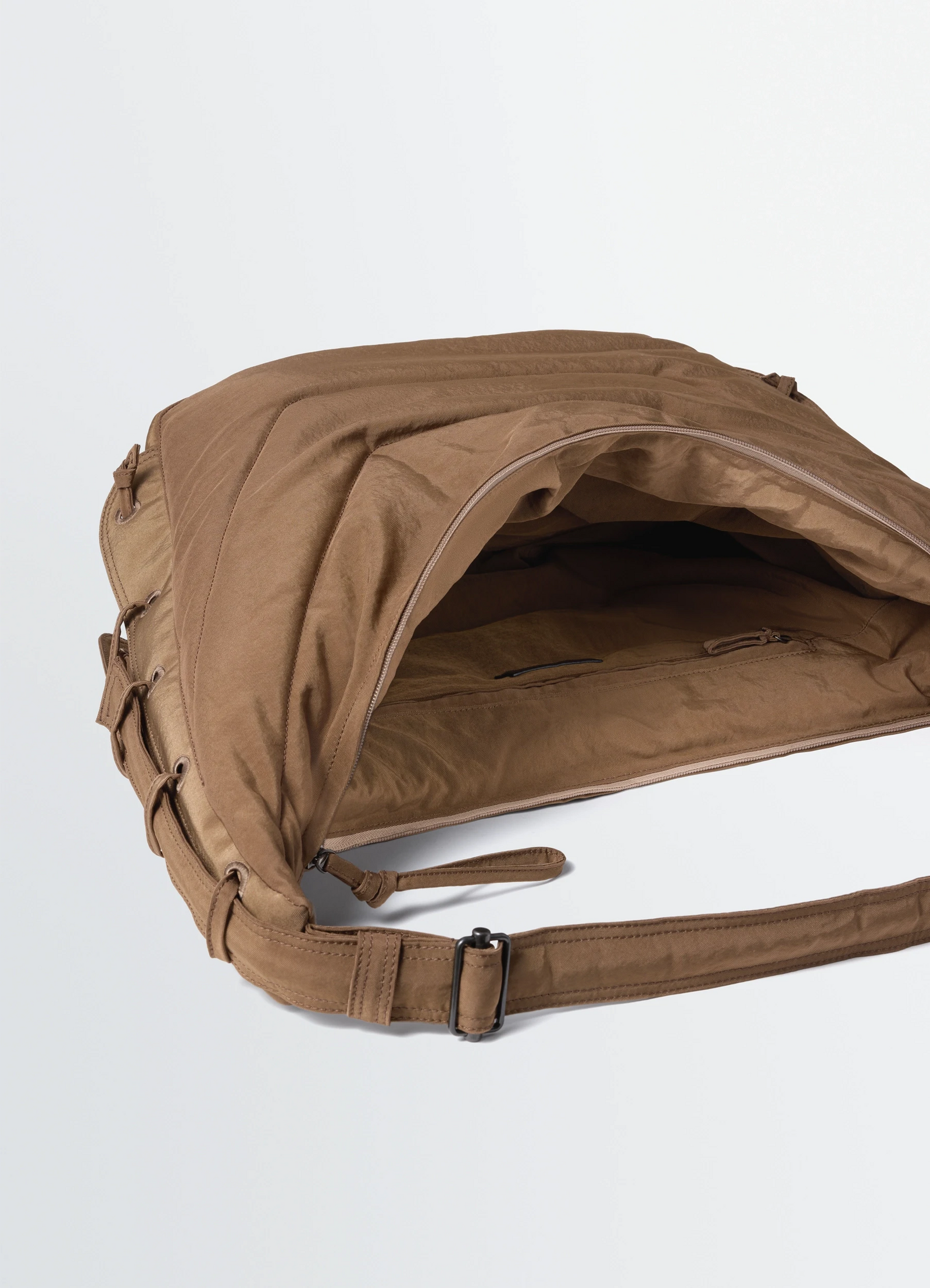 Large soft game bag in brown nylon canvas, product shot, top angled view zippered interior pocket