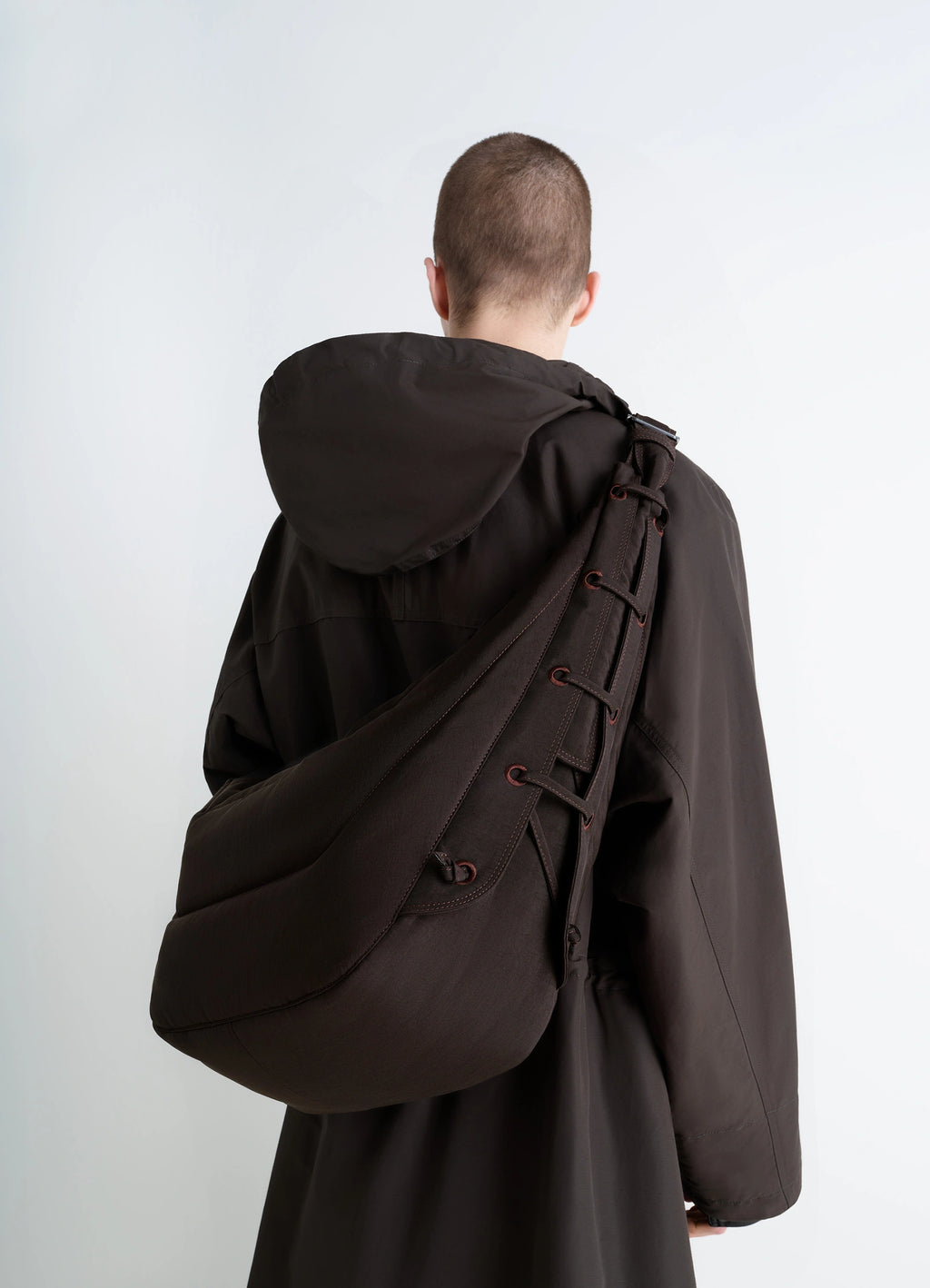 Large Soft Game Bag in Quilted, water-repellent nylon, model shot, back view crossbody style with lace detail