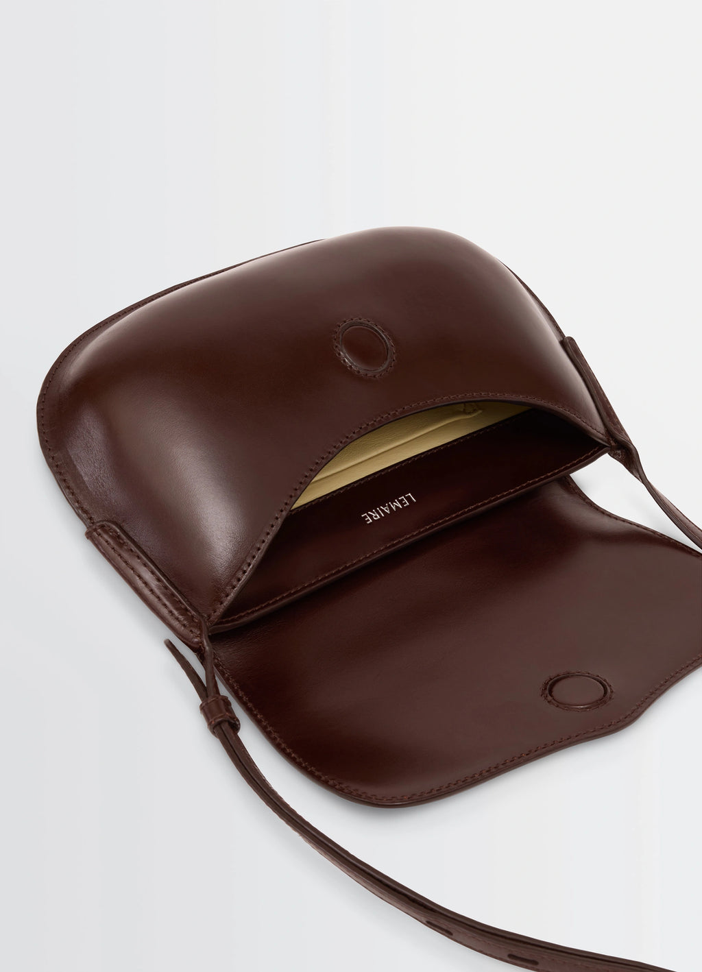 Lemaire Belly Bag in Silver LWG-certified leather, product shot, interior detail shot minimalist open flap design