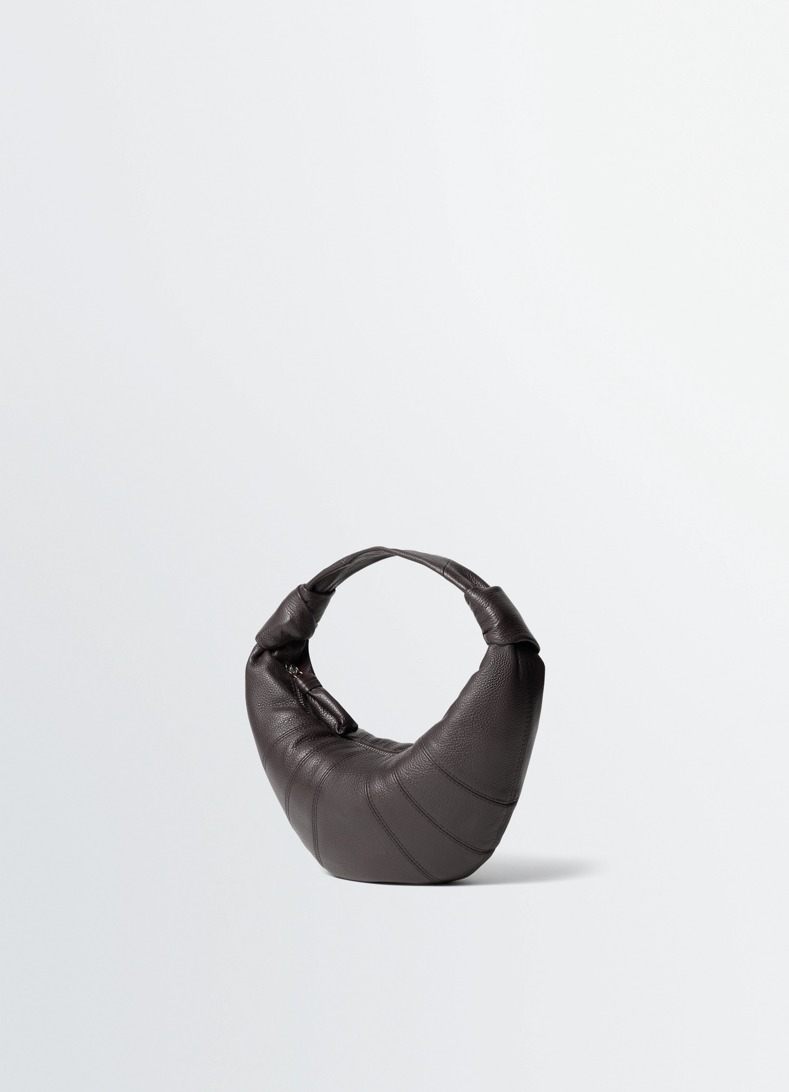 Mini fortune croissant bag in grained leather, product shot, three-quarter rear view padded crescent shape