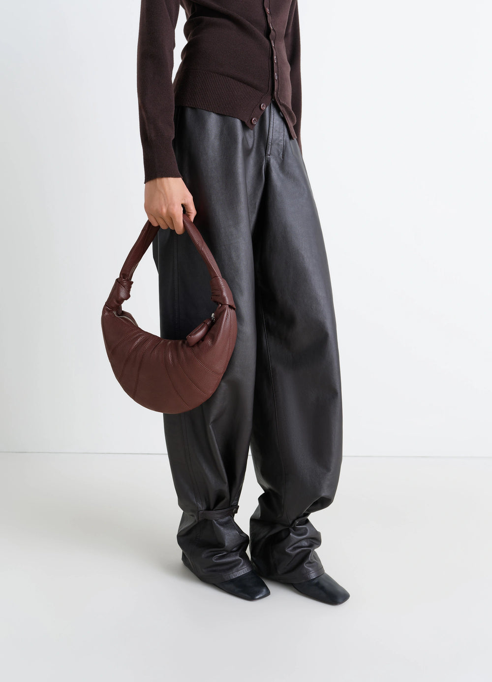 Mini Fortune Croissant Bag in Brown Grained Leather, model shot, Side view Knotted elements detail