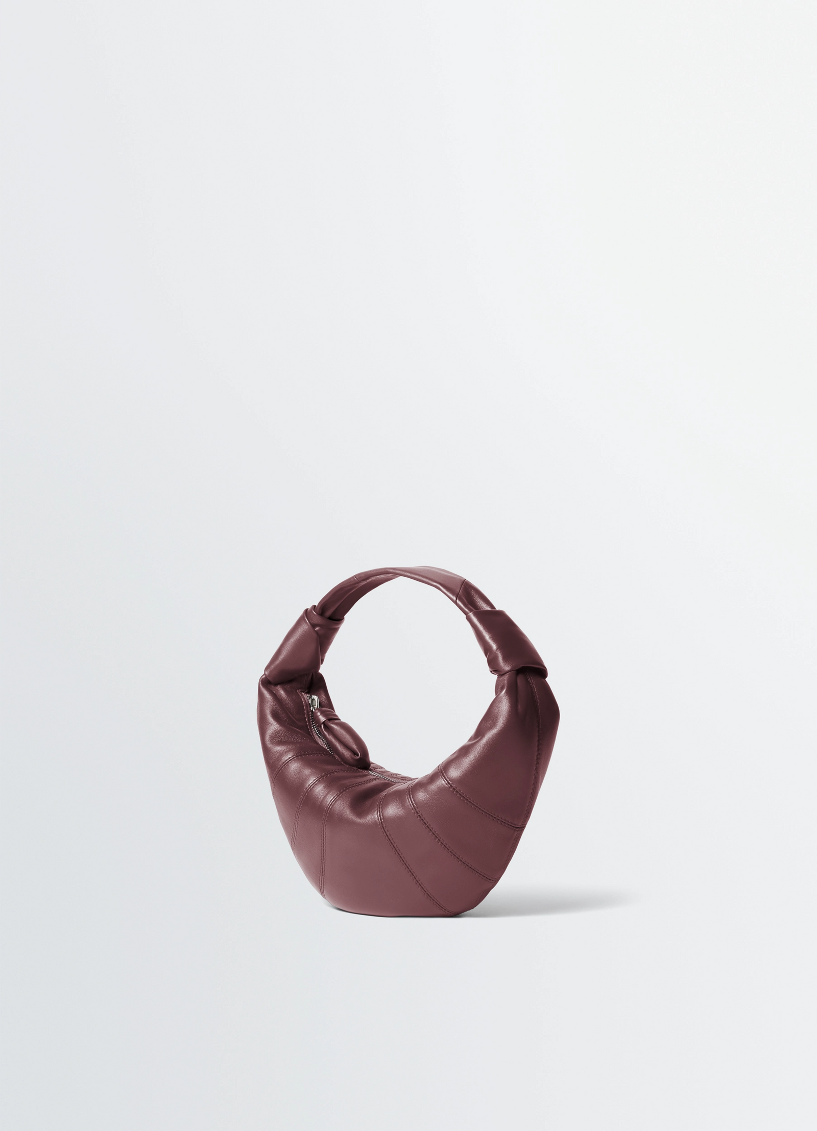 Mini fortune croissant bag in soft nappa lambskin leather, product shot, three-quarter view arched silhouette design