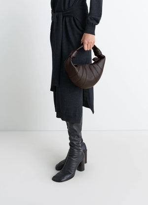 Mini Fortune Croissant Bag in Soft nappa lambskin leather, model shot, Side view Knotted elements, half-moon