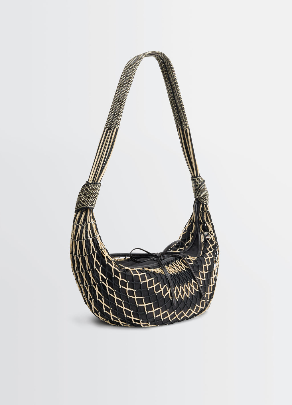 Croissant Filt Bag in Nylon Net Black, product shot, side profile view woven strap detail