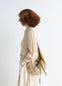 Lemaire Croissant Filt Bag in Beige Nylon Net, model shot, Side view With removable inner bag