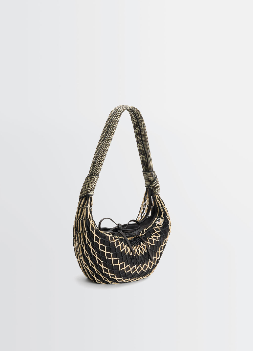 FORTUNE CROISSANT FILT BAG in nylon net with removable bag, product shot, side profile view woven handle accent