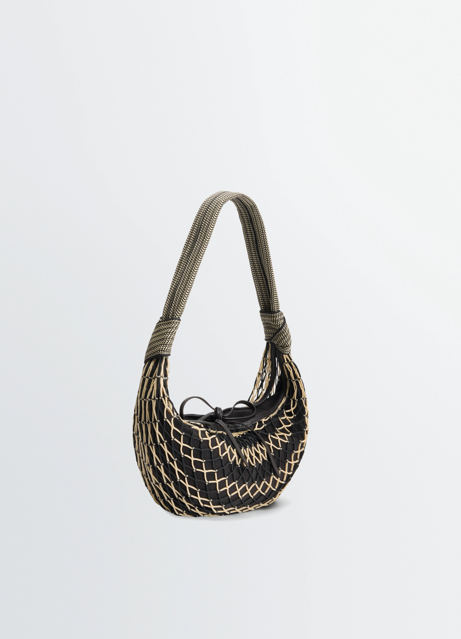 Fortune croissant filt bag in black nylon net, product shot, angled top view curved woven structure