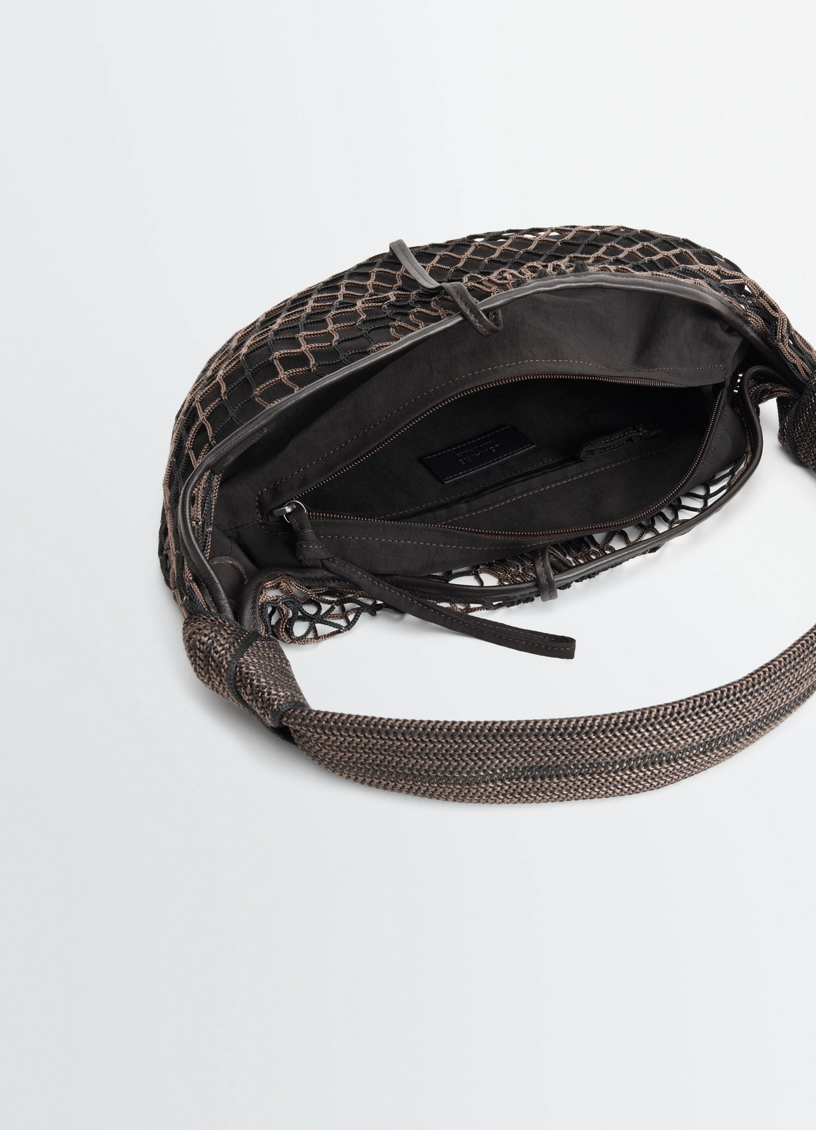 Fortune croissant filt bag in black nylon net, product shot, top interior view intricate netted stitching