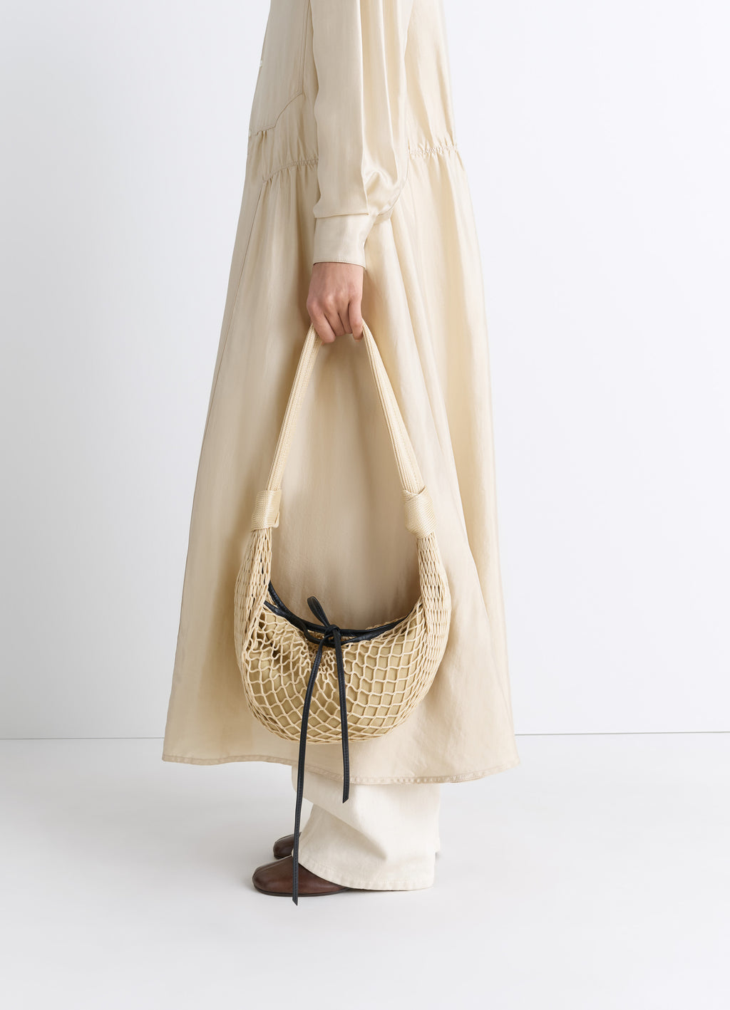 Fortune Croissant Filt Bag in Nylon Net, model shot, Side view Held by model