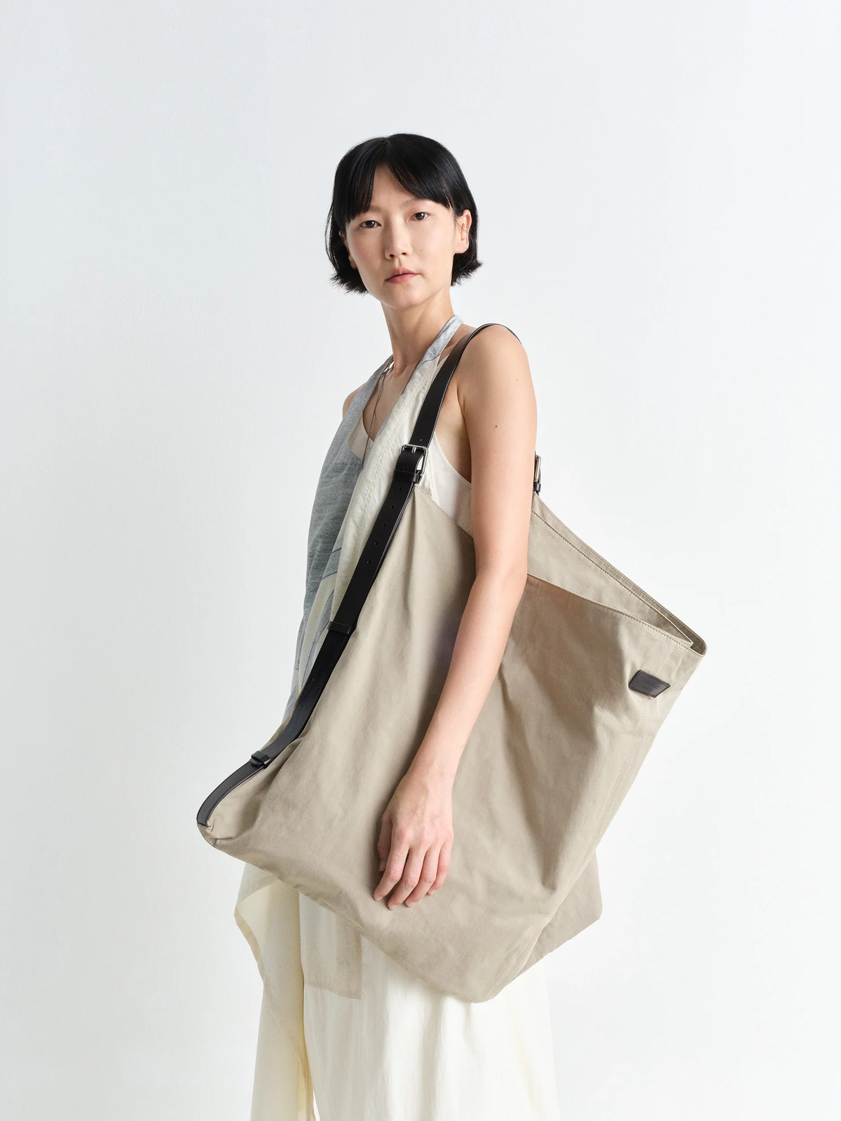 Flag hobo bag in washed cotton bachette, model shot, side view worn by model