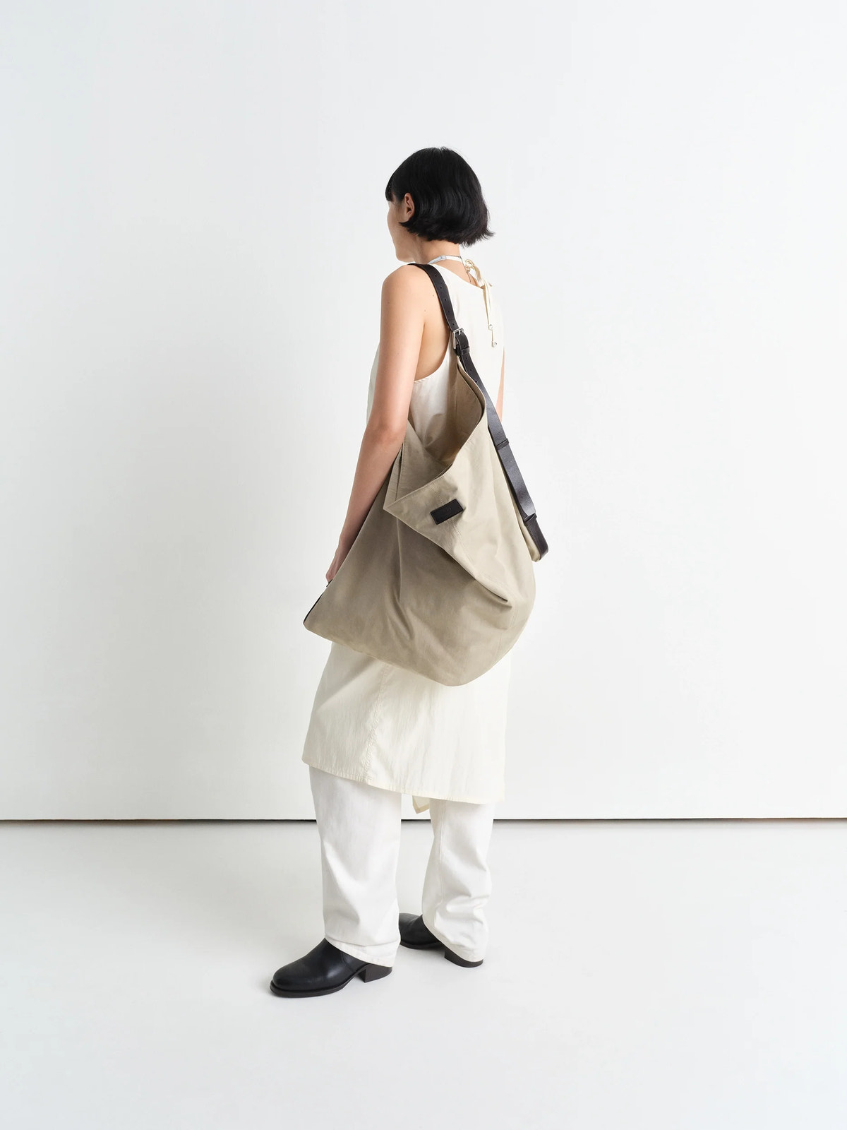 Flag hobo bag in washed cotton bachette, model shot, back view over-shoulder worn