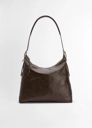 Lemaire belted hobo bag in thin shiny leather, product shot, front view rounded body shape