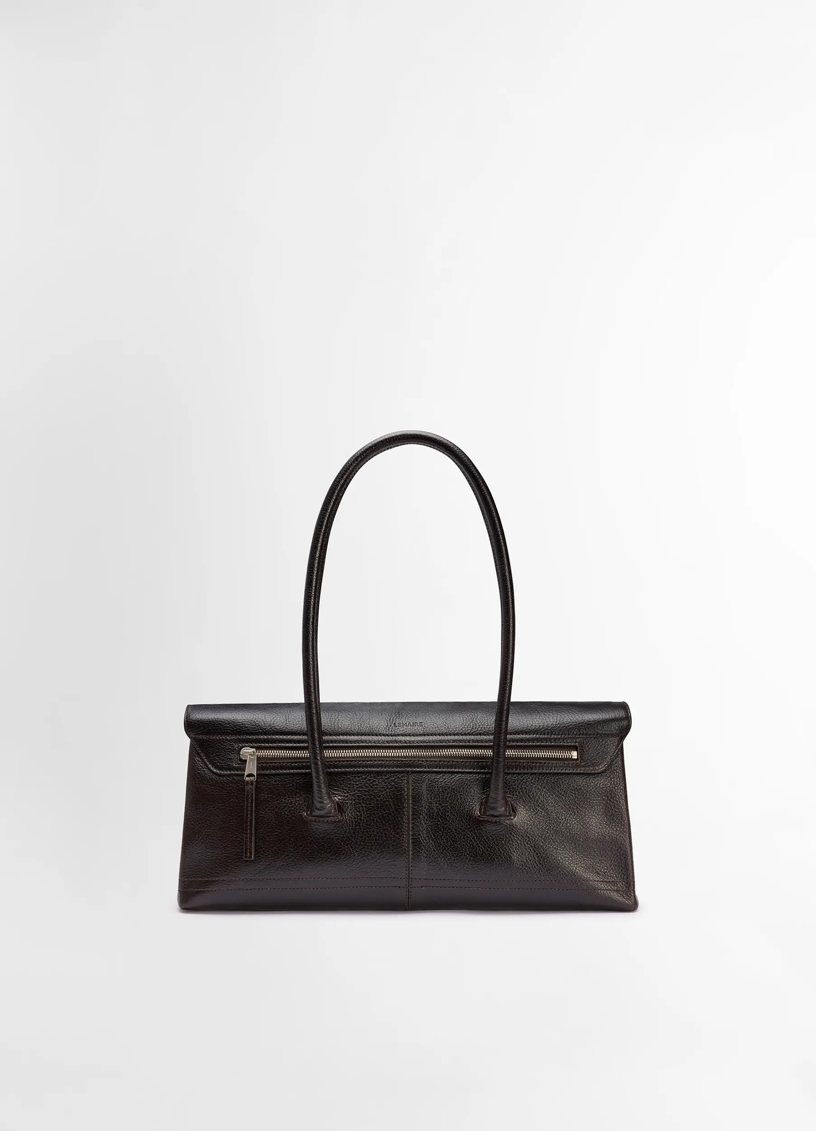 Lemaire shoulder gear bag in dark brown vegetable-tanned leather, product shot, back view zippered back pocket