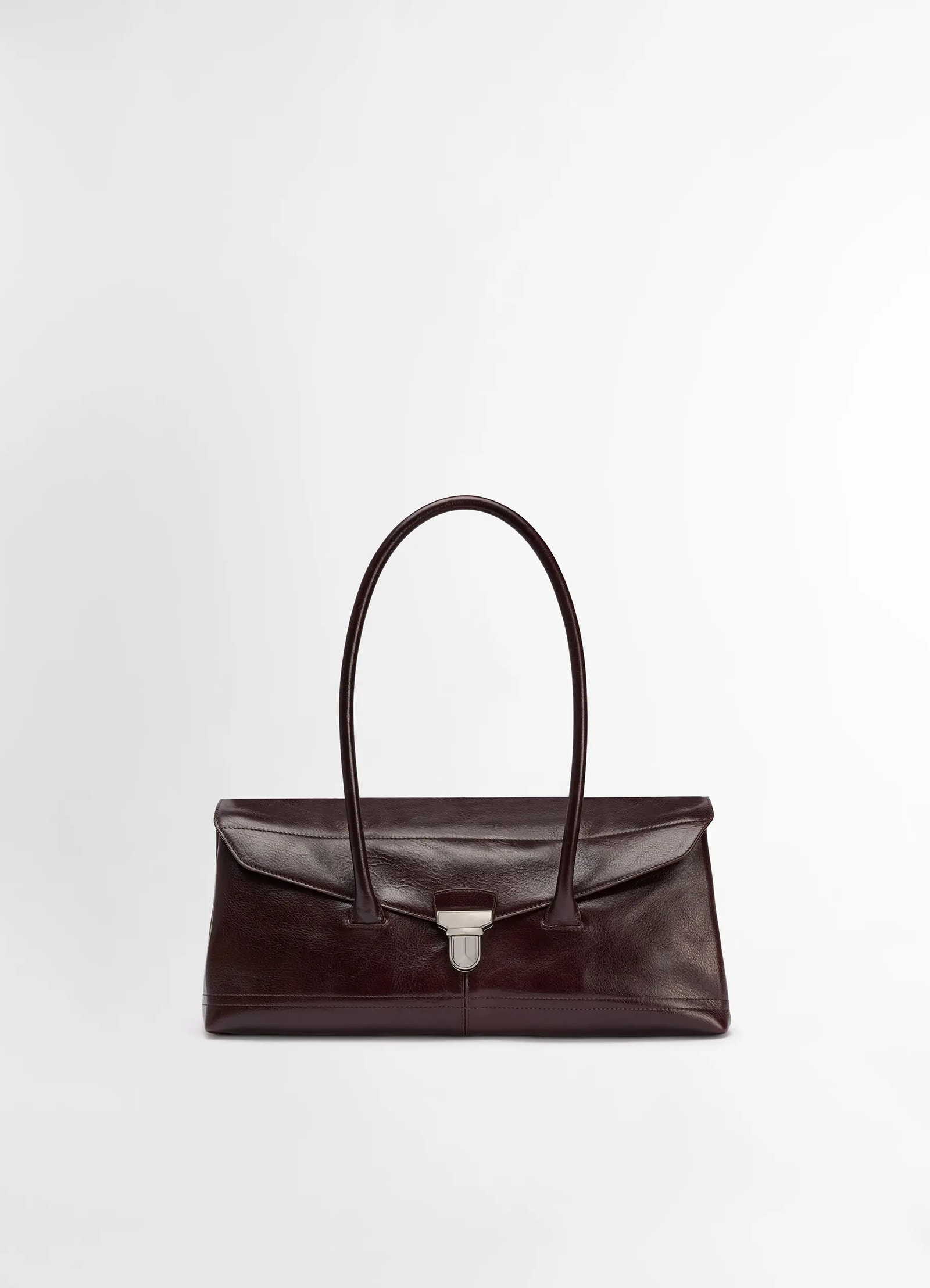 Lemaire shoulder gear bag in glossy vegetable-tanned leather, product shot, front view structured handle design