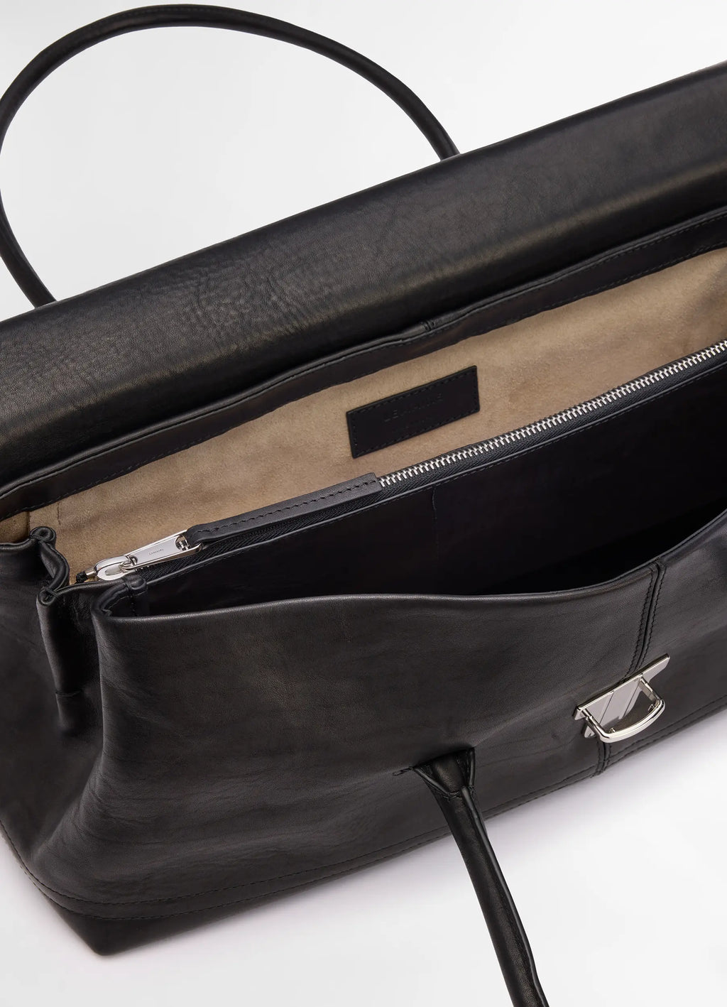 Lemaire Shoulder Gear Bag in Black Vegetable Tanned Nappa, product shot, interior top view metallic clasp detail