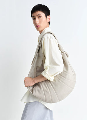 XL Croissant Bag in Heavy Cotton Canvas, model shot, Side View Spacious Unisex Style