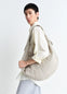 XL Croissant Bag in Heavy Cotton Canvas, model shot, Side View Spacious Unisex Style