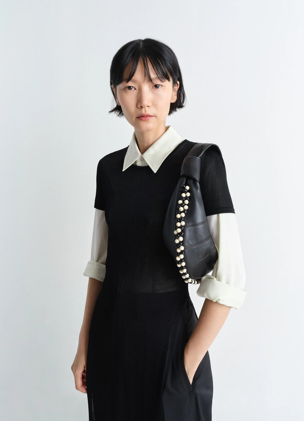 Mini Fortune Bag with Beads in Soft Nappa Lamb Leather, model shot, Front view Short handle worn on shoulder