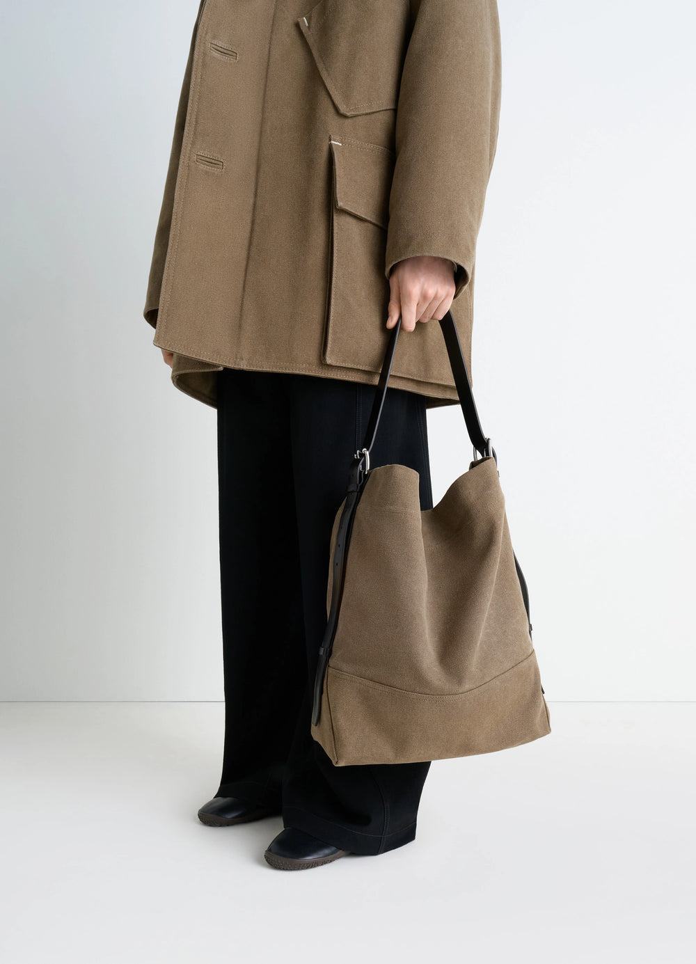 Belted Tote Bag in Heavy Cotton Canvas, model shot, side view held by hand
