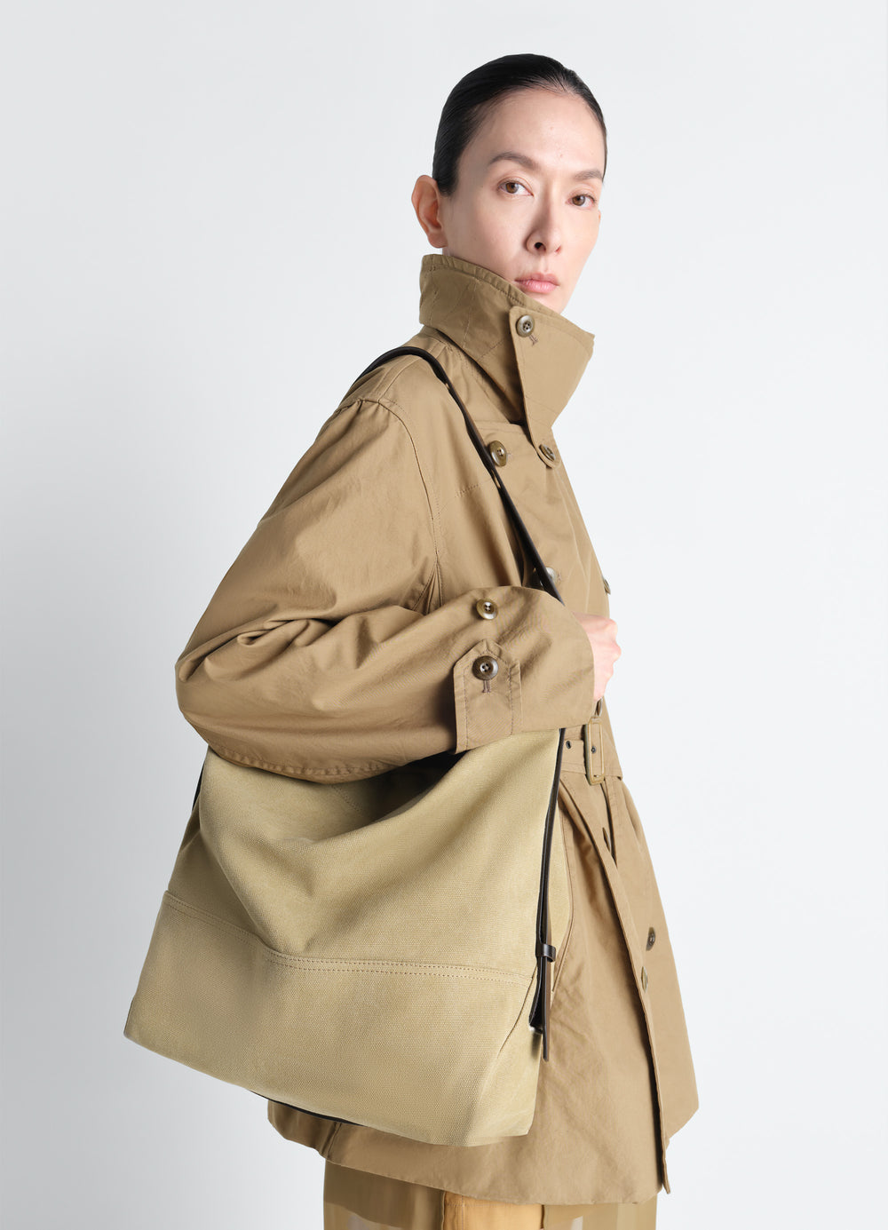 Belted Tote Bag in Cotton Canvas, model shot, over-shoulder view buckled strap detail