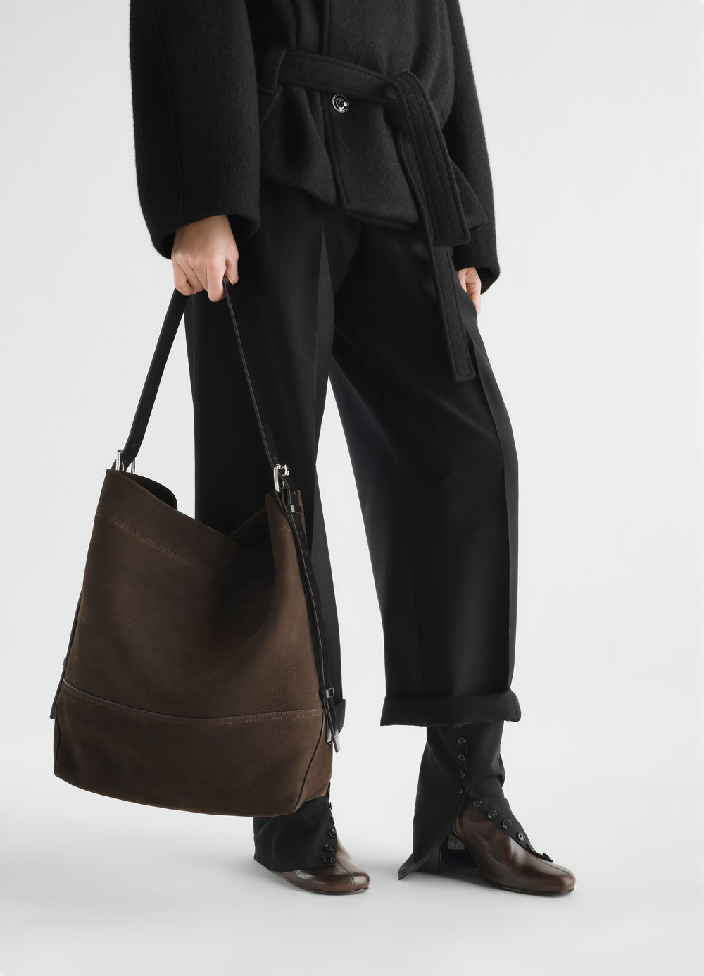 Belted brown alpaca nubuck tote bag LEMAIRE worn by model with black pants and coat front view