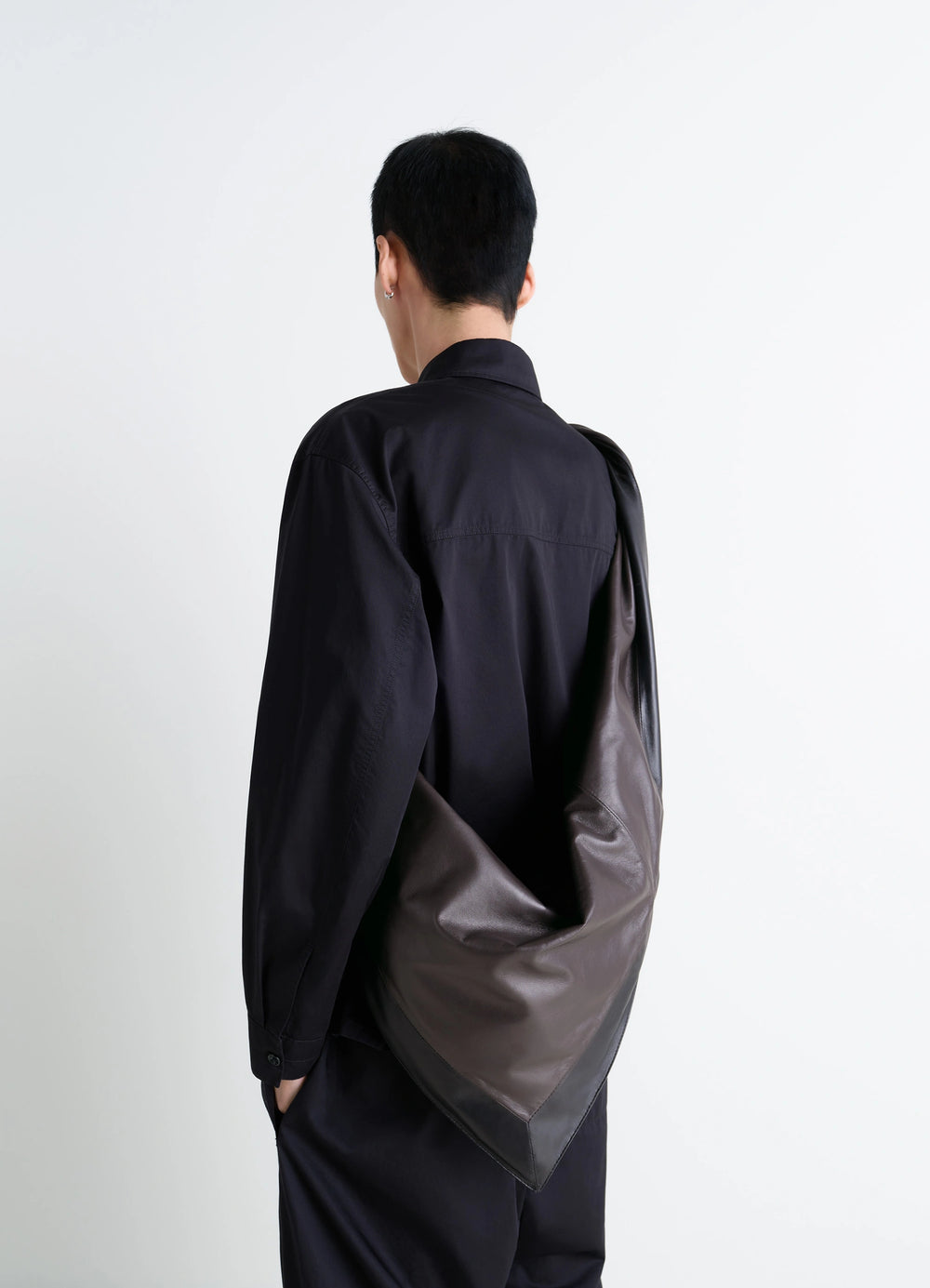 Lemaire Scarf Bag in nappa leather, model shot, back view draped shoulder hang