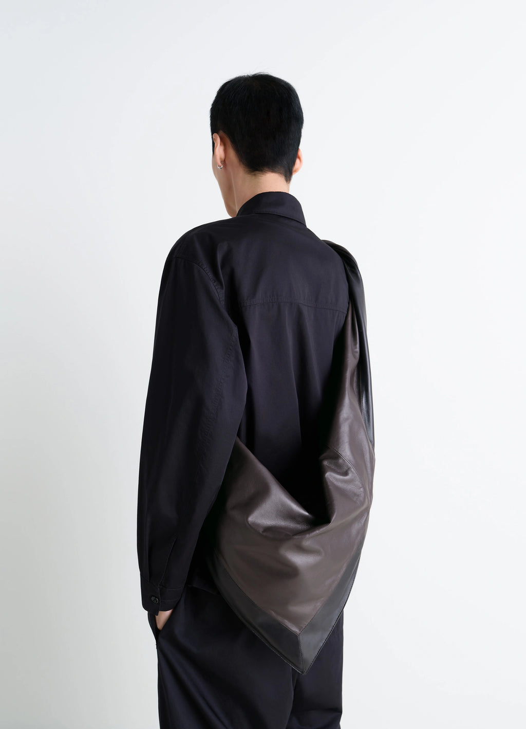 Lemaire Scarf Bag in nappa leather, model shot, back view draped shoulder hang