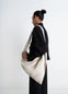 Lemaire Scarf Bag in Nappa Leather, model shot, Side view Twisted strap