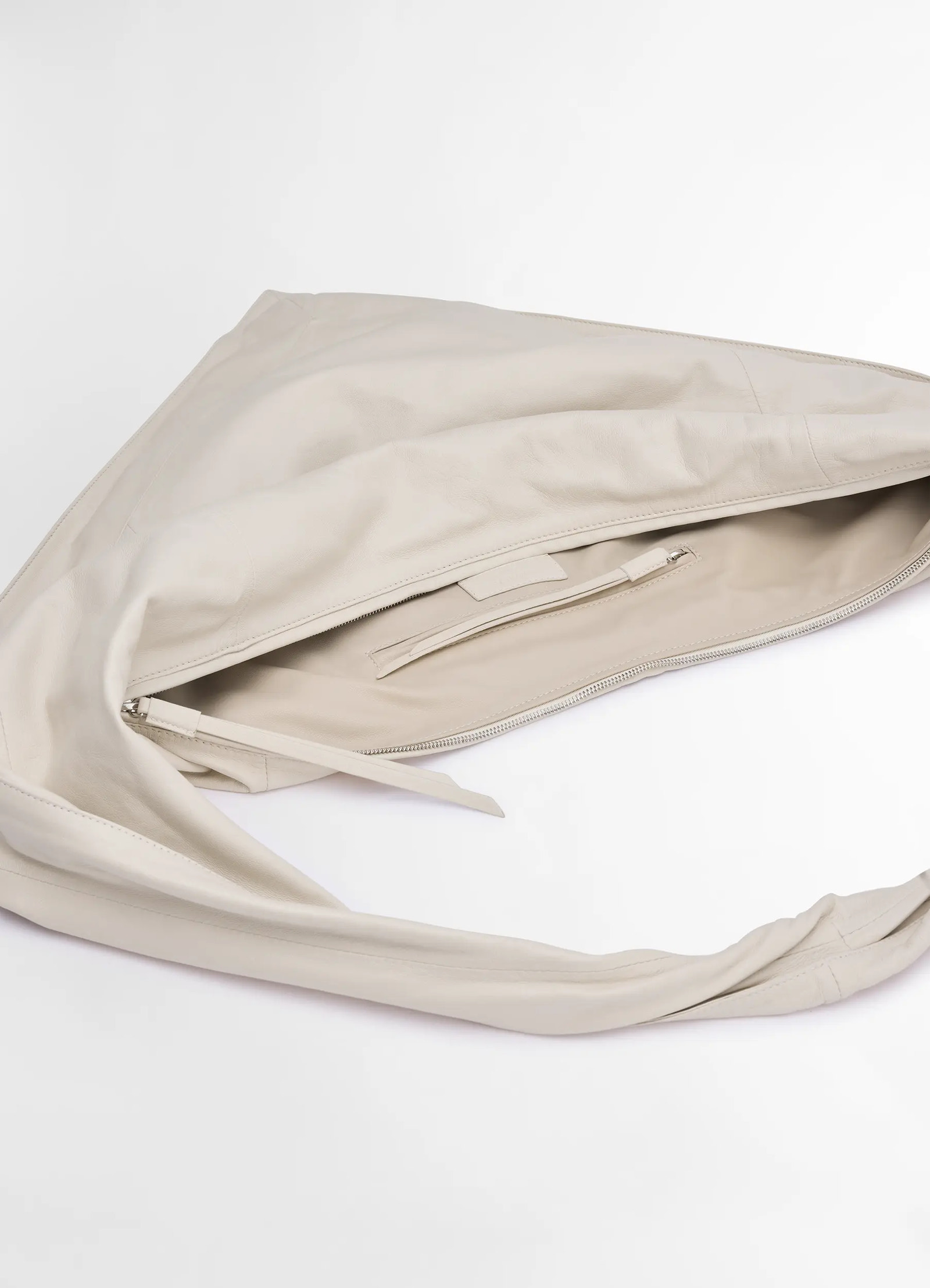 Lemaire scarf bag in nappa leather, product shot, top open view inside zip pocket, soft finish