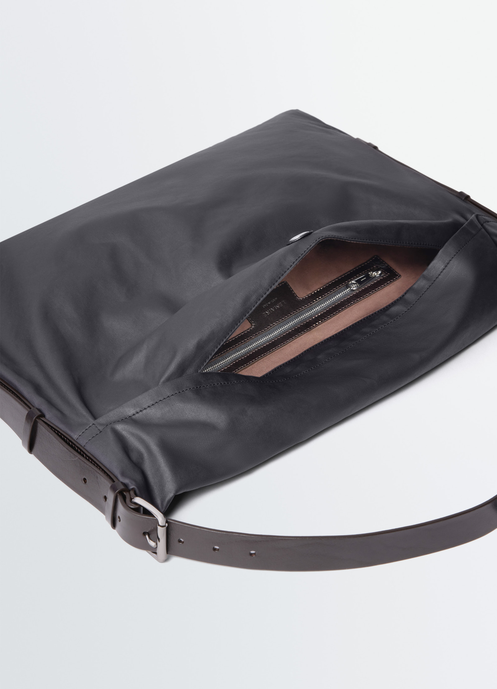 Medium trench pocket bag in water-repellant resinated cotton, product shot, partial top view open zipper interior