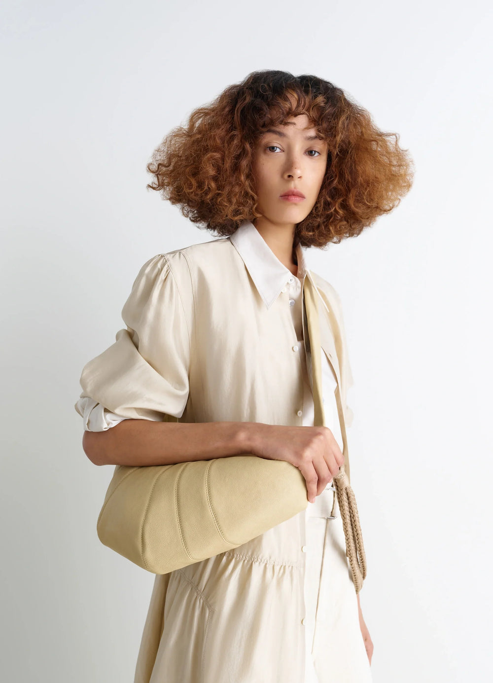Lemaire Braid Medium Croissant Bag in Grained Buffalo Leather, model shot, Side view Braided shoulder strap