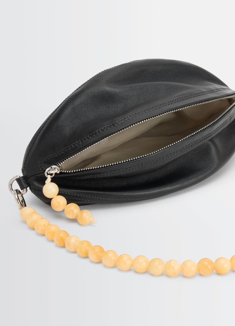 Lemaire Balloon Pouch in Black Nappa Lamb Leather, product shot, open top angle zipped opening detail