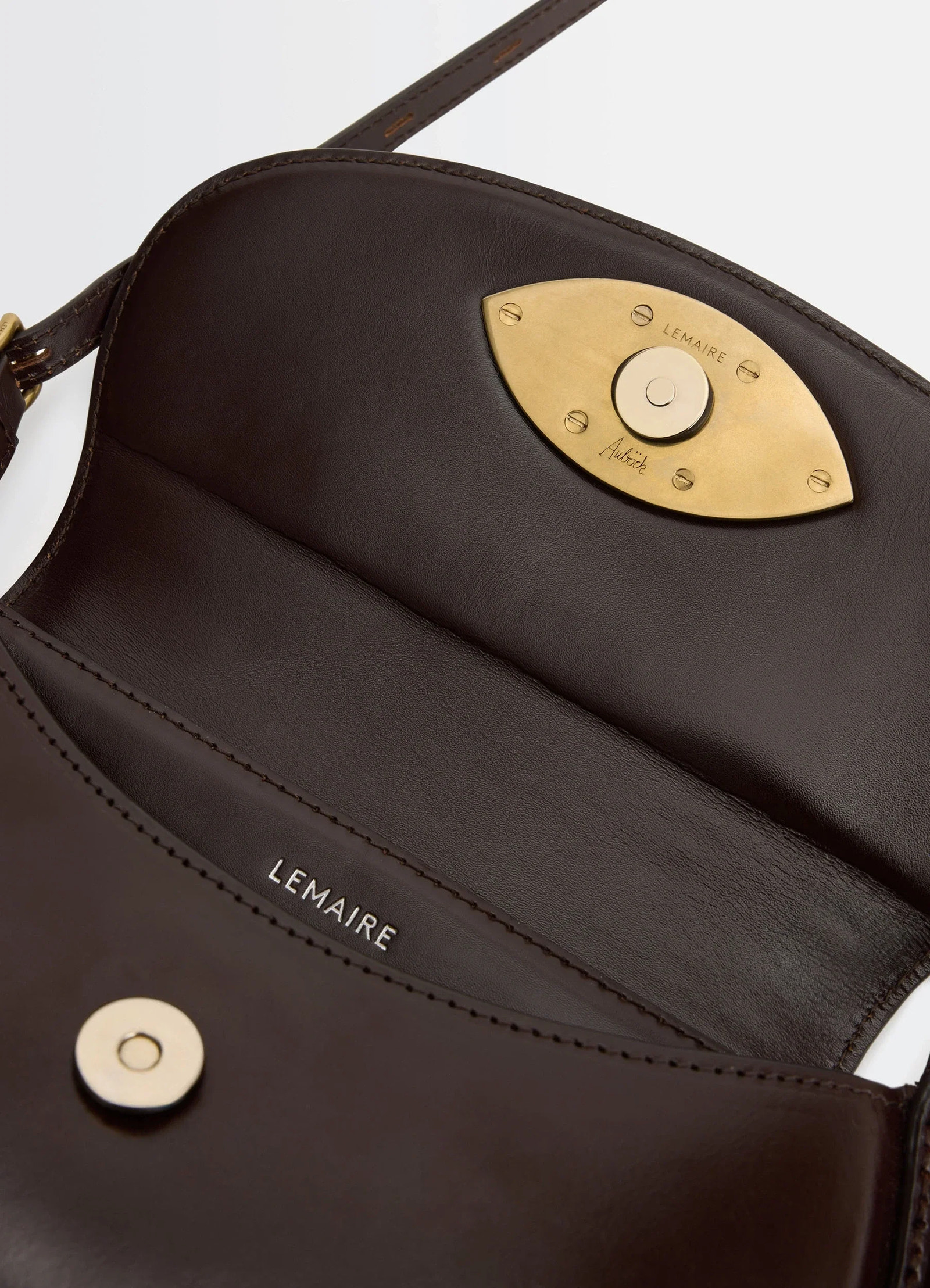Aubock eye bag in brown leather, product shot, interior detail shot eye-shaped gold clasp