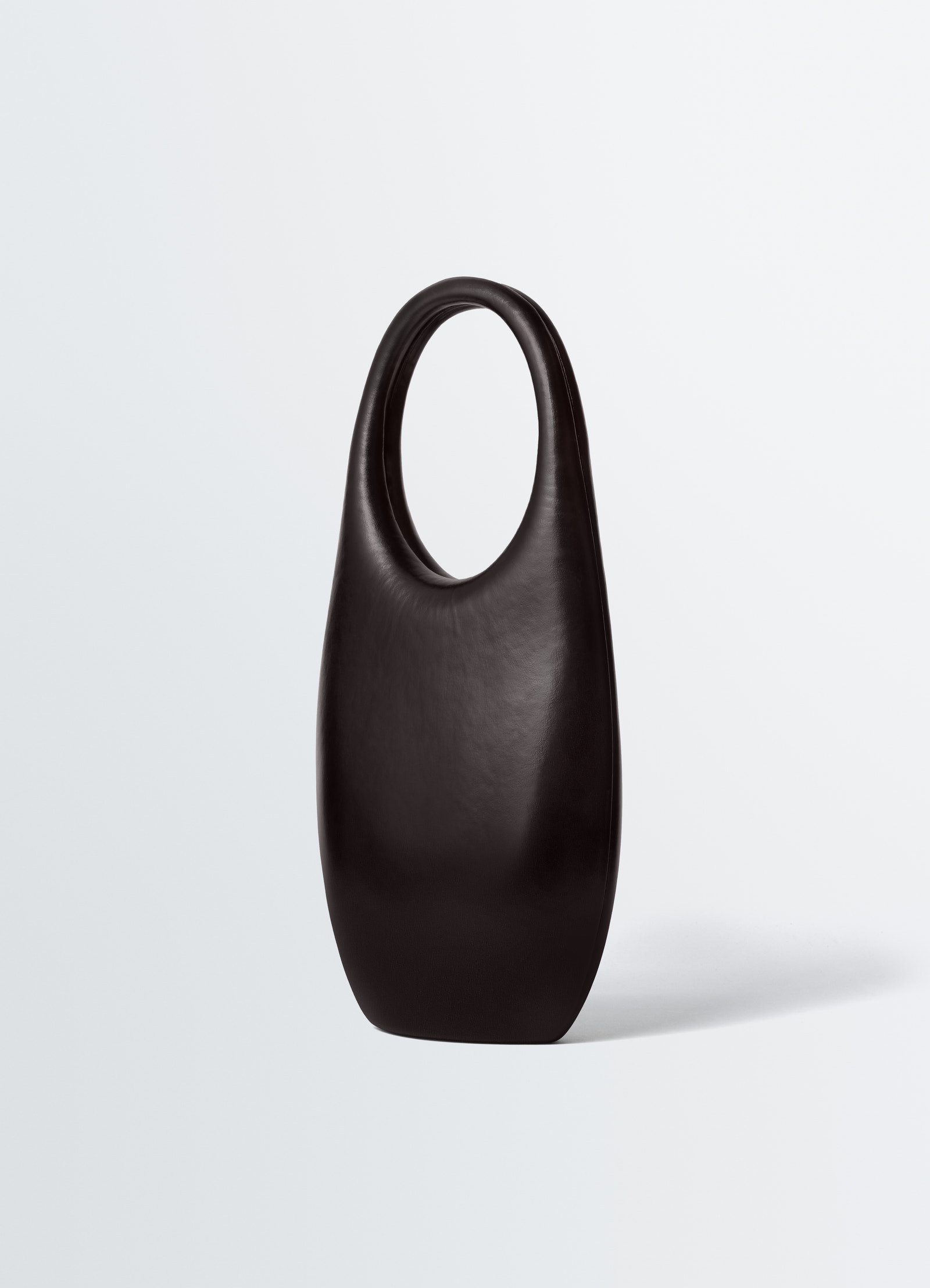 Carlos peñafiel naho black molded leather bag lemaire front studio shot on white background