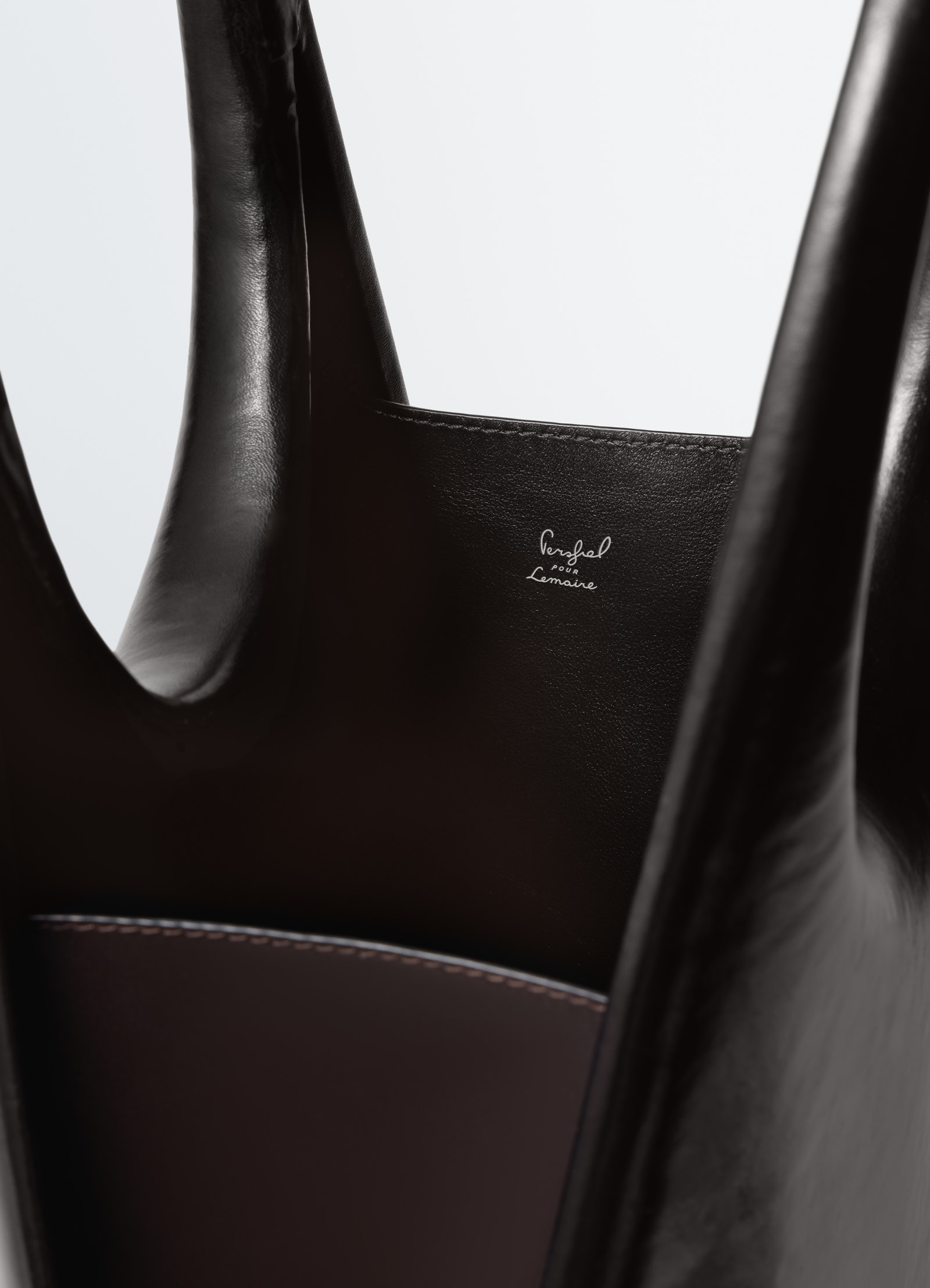 Carlos peñafiel black molded leather naho bag for lemaire close-up detail of inside logo and stitching