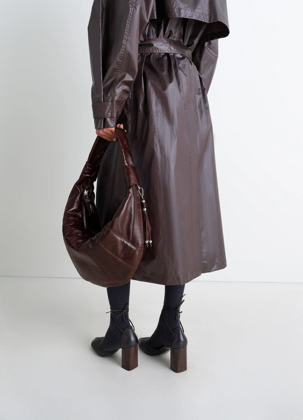 Lemaire Fortune Croissant Bag in Coated Cotton Canvas, model shot, Back view Half-moon silhouette