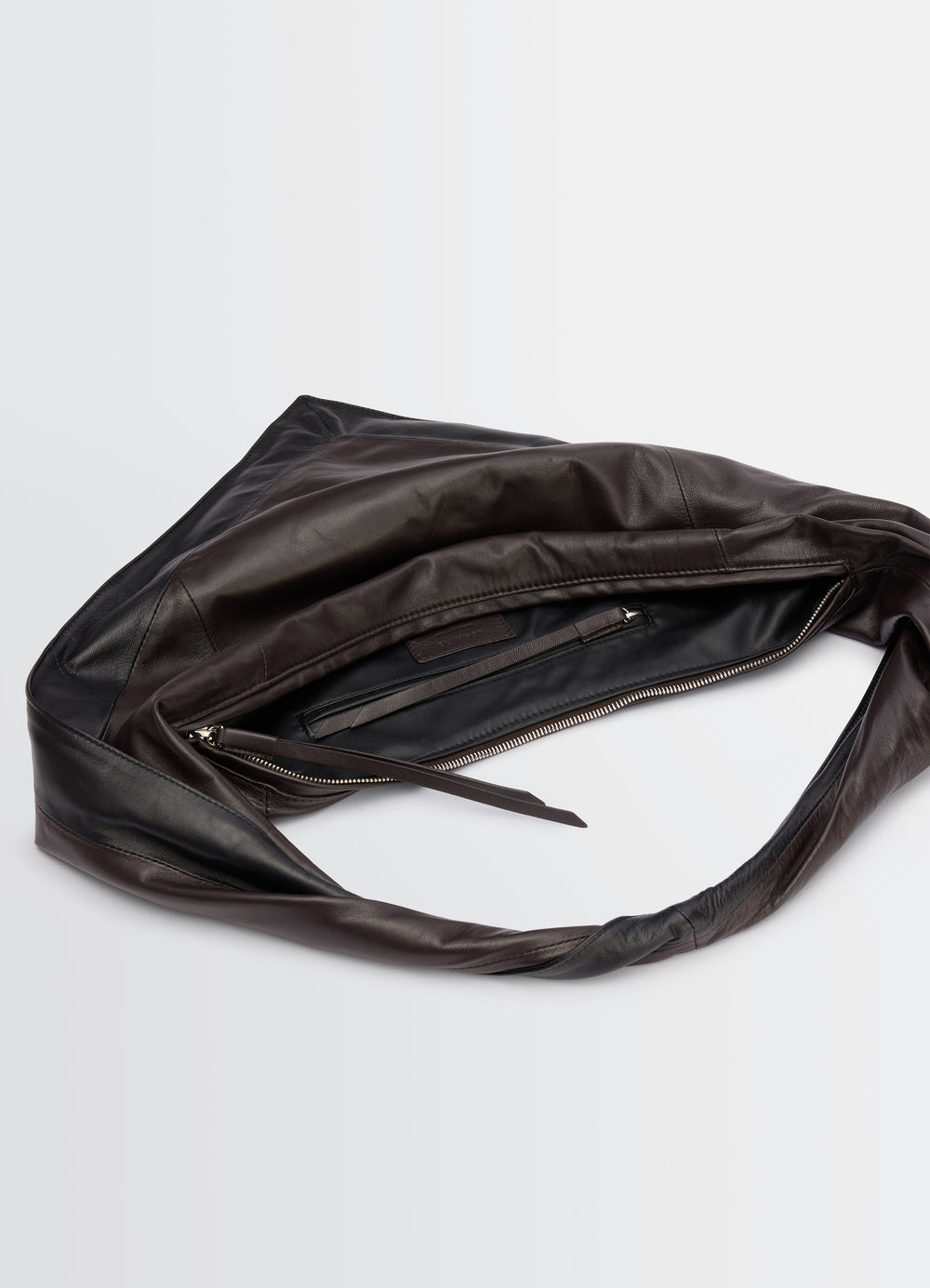 Small Scarf Extended Handle Bag LEMAIRE dark brown and black leather shown open with zipper detail on white background