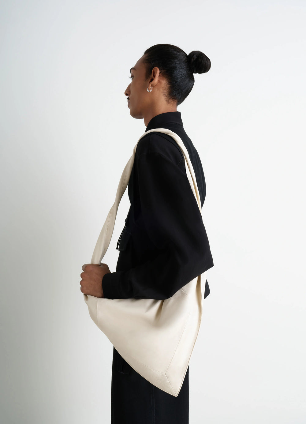 Lemaire Small Scarf Extended Handle in Nappa Leather, model shot, profile view curved base structure