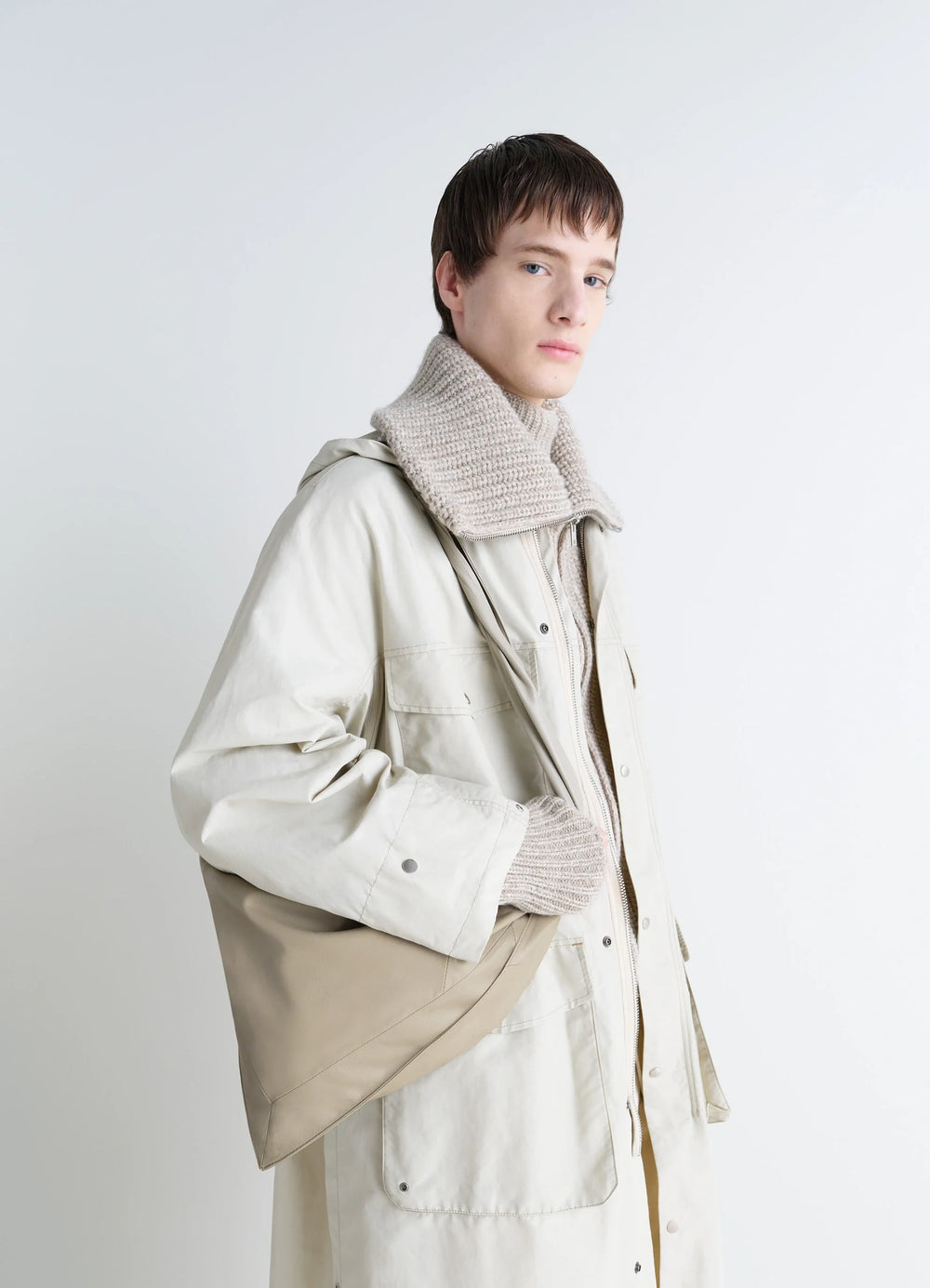 Lemaire Small Scarf Extended Handle in Nappa Leather, model shot, three-quarter view soft shape hanging