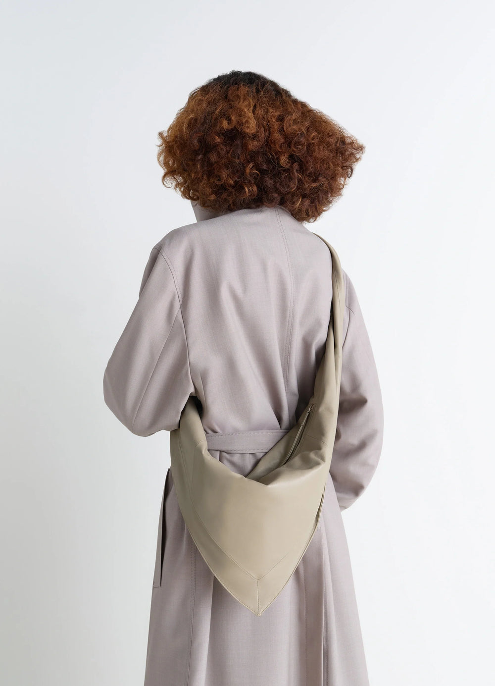 Lemaire Small Scarf Extended Handle in Nappa Leather, model shot, Back view Twisted strap detail